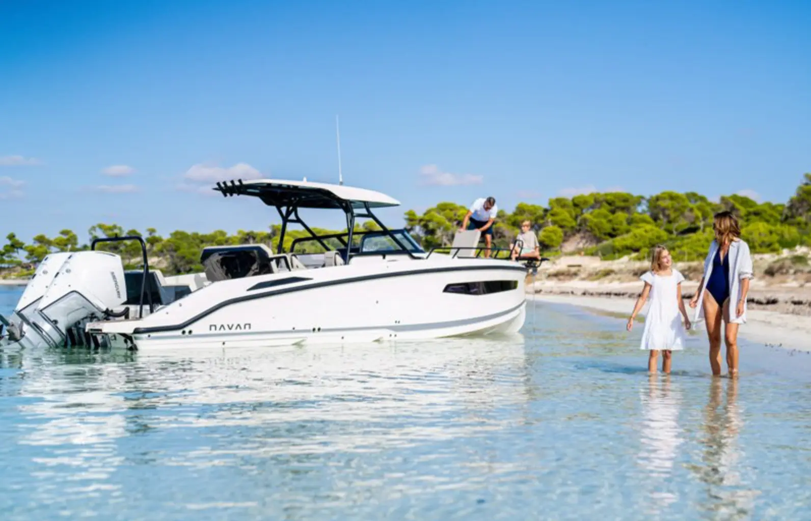 Caribbean cove and modern powerboat