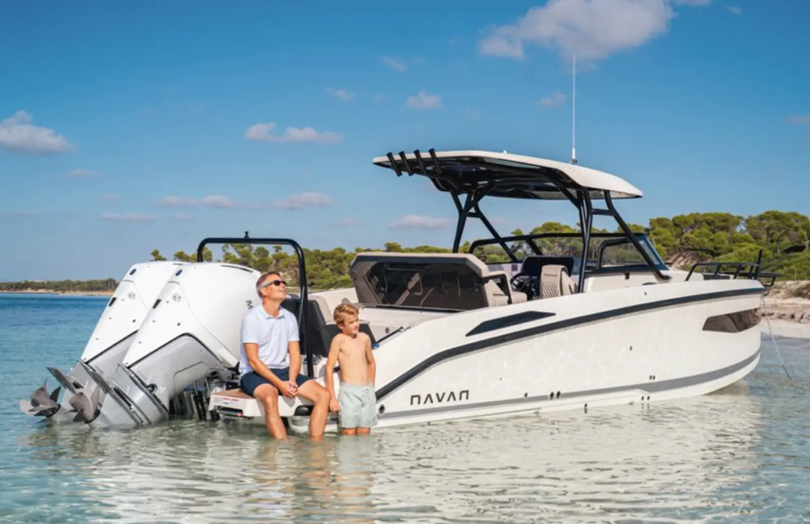 Family enjoying the sea alongside a powerboat